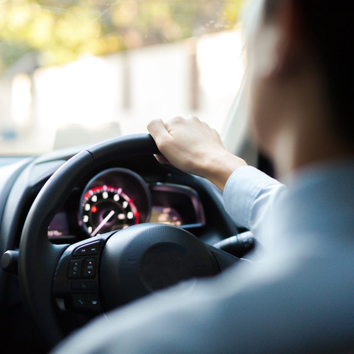 man drives a car