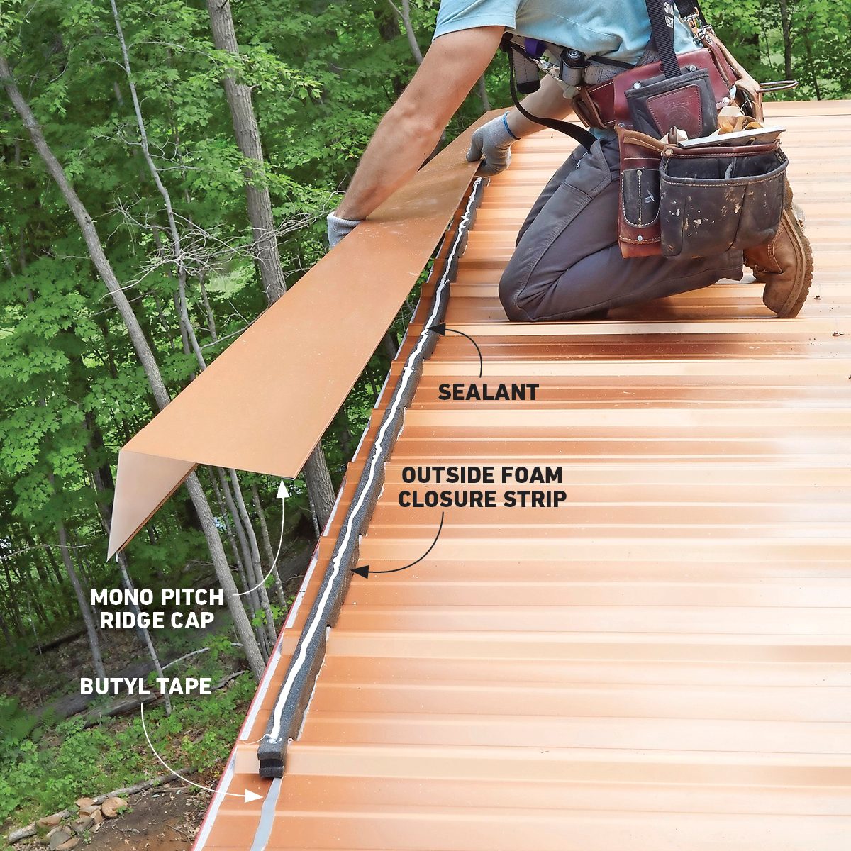 A person installs a metal ridge cap on a roof, applying sealant along a closure strip in a wooded outdoor setting.