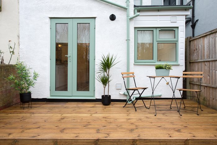 teal exterior window trim on house