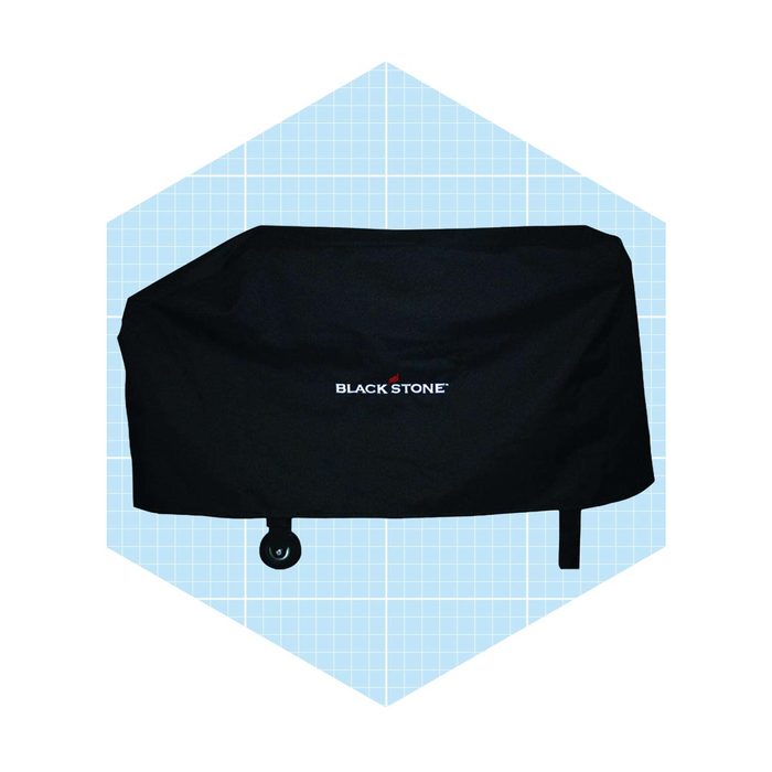 A black outdoor grill cover rests on an object, featuring a logo. It is presented against a light blue grid background.